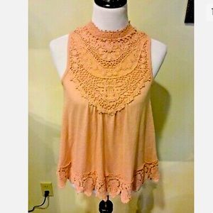 Peach Taylor and sage top.